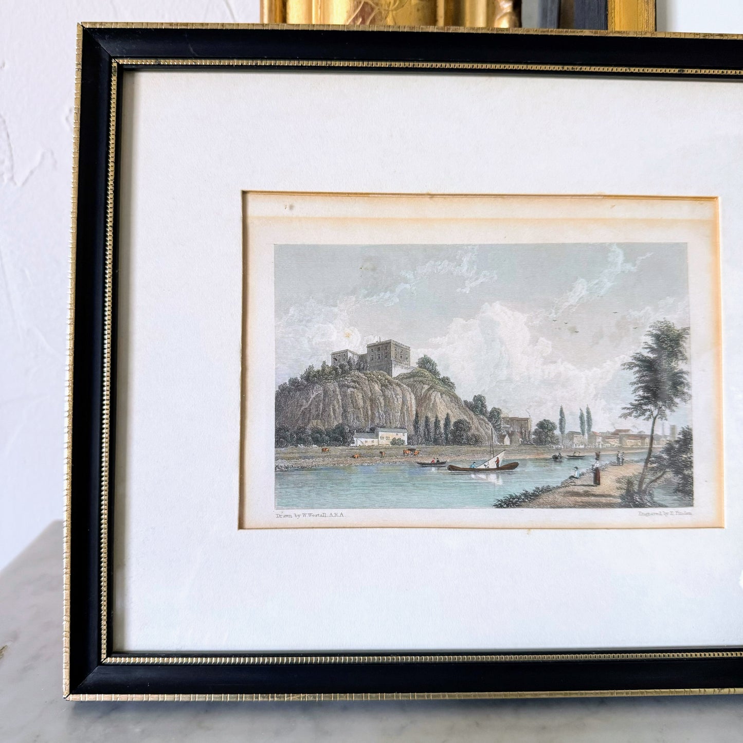 English Framed Print of Riverfront Town